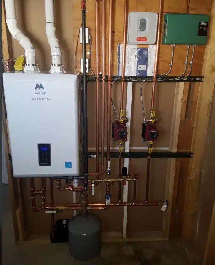Wall-hung boiler and piping installation