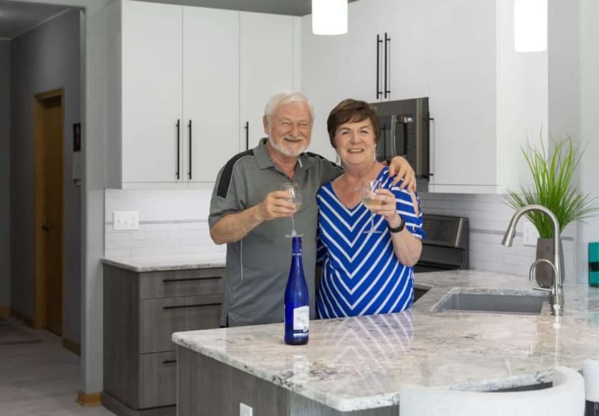 Homeowners celebrating their finished remodel