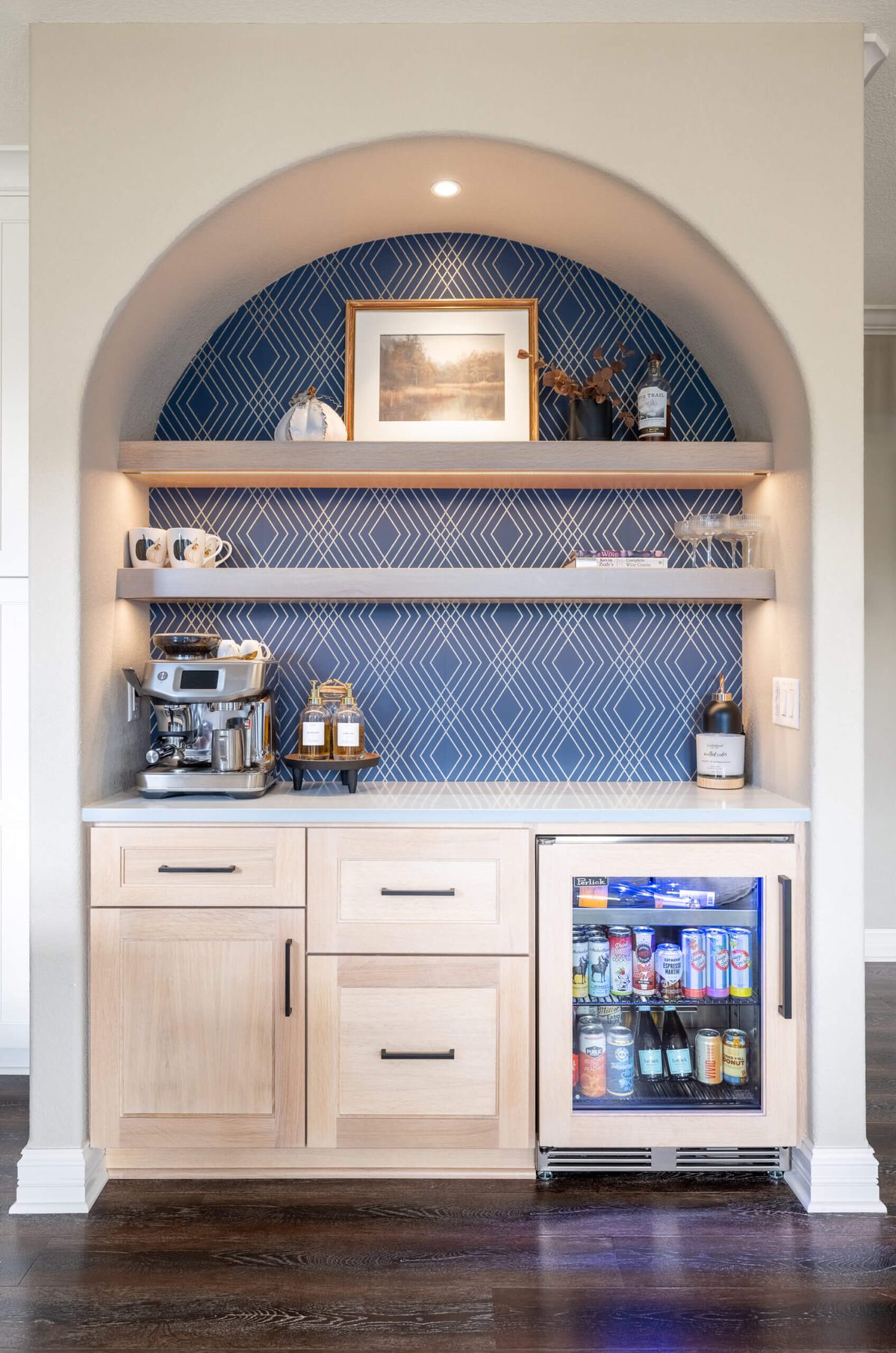 Arched coffee bar niche with navy wallpaper