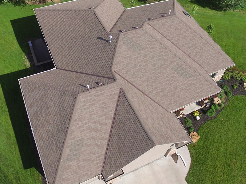 Home exterior with new gutters and siding