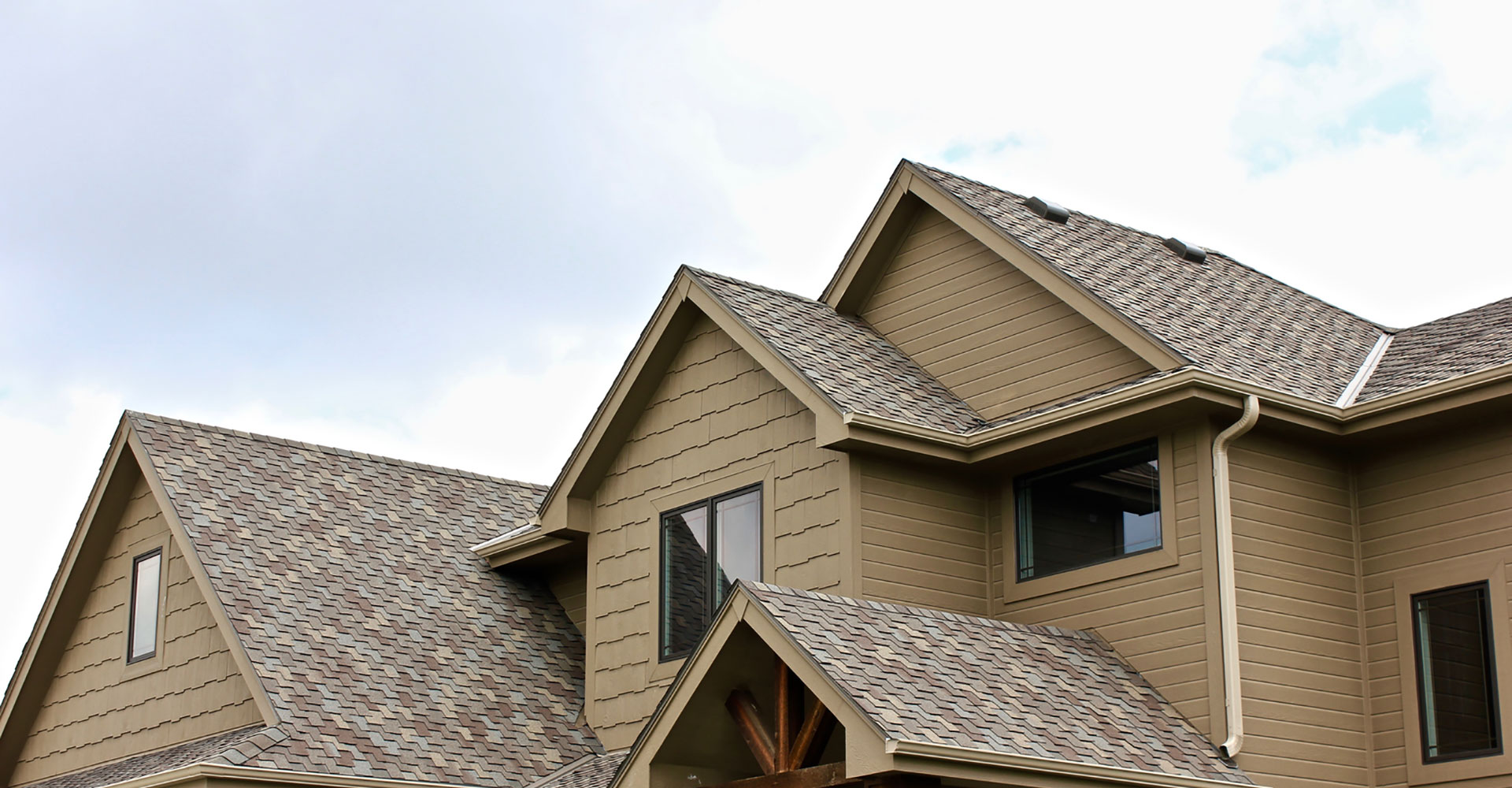 Asphalt shingle roof treated with Roof Maxx