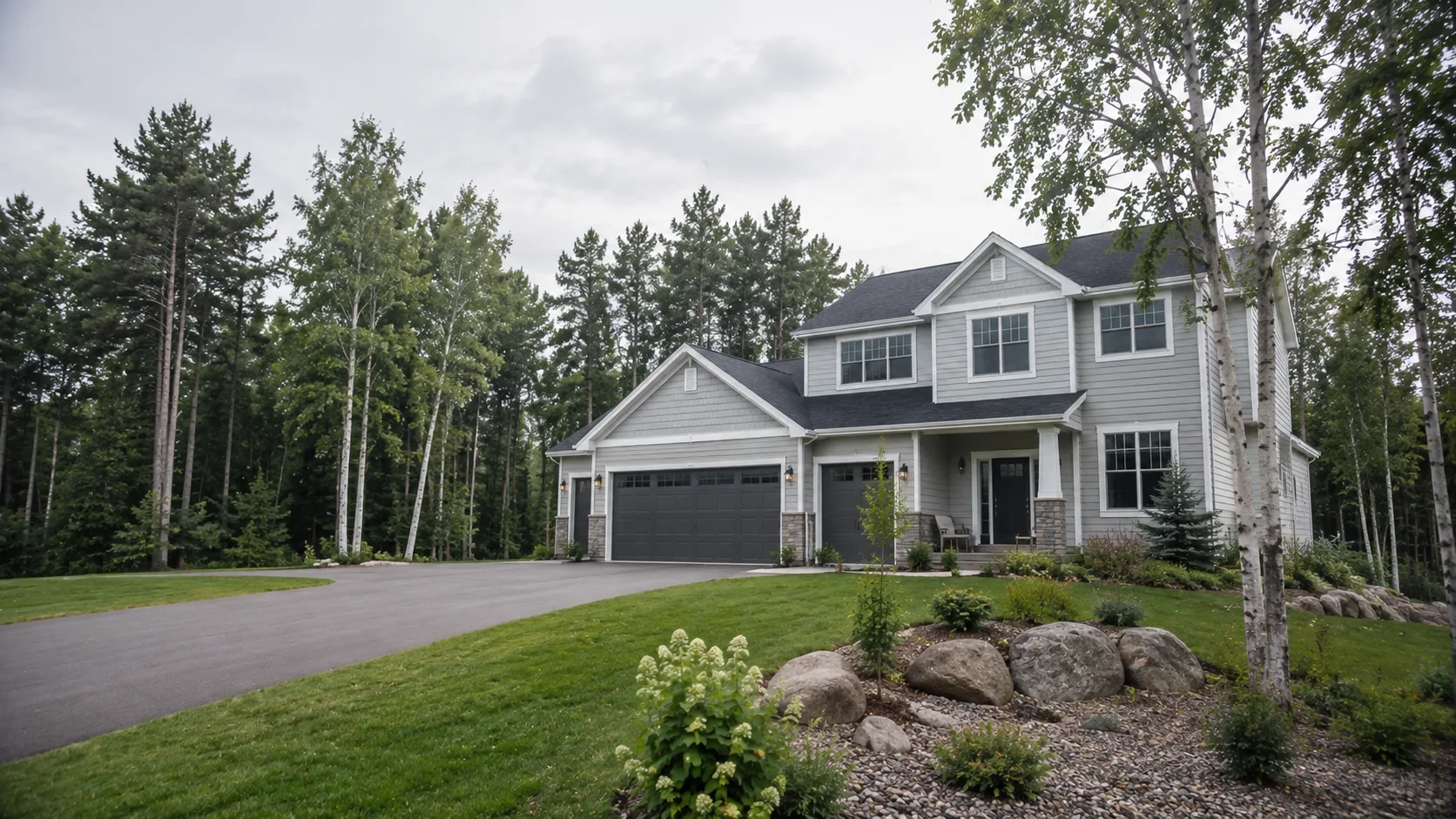 Clean suburban home on a large pine-lined Hermantown lot