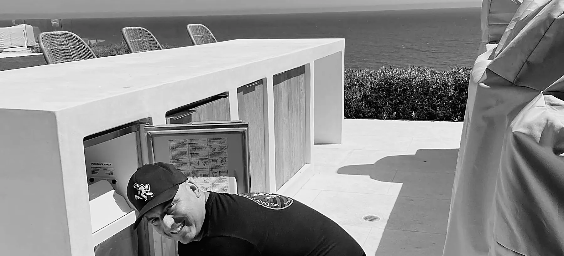Danny working on an outdoor kitchen above the water