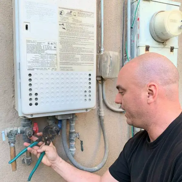 Tankless water heater, gas valves and flex connections at the wall unit