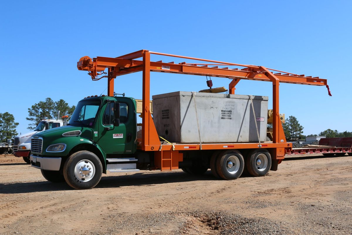 Precast grease trap loaded on a trailer