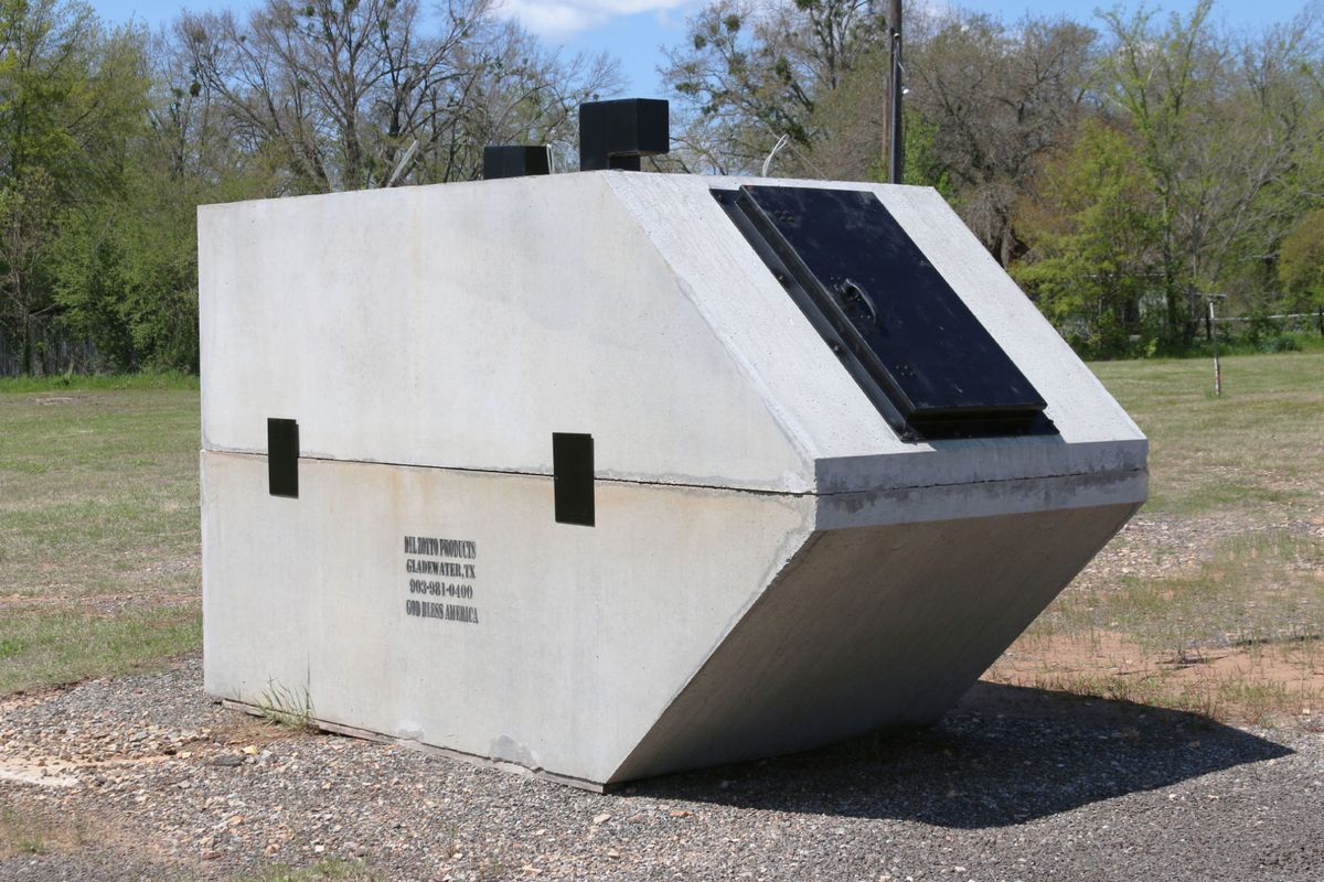 Precast in-ground storm shelter