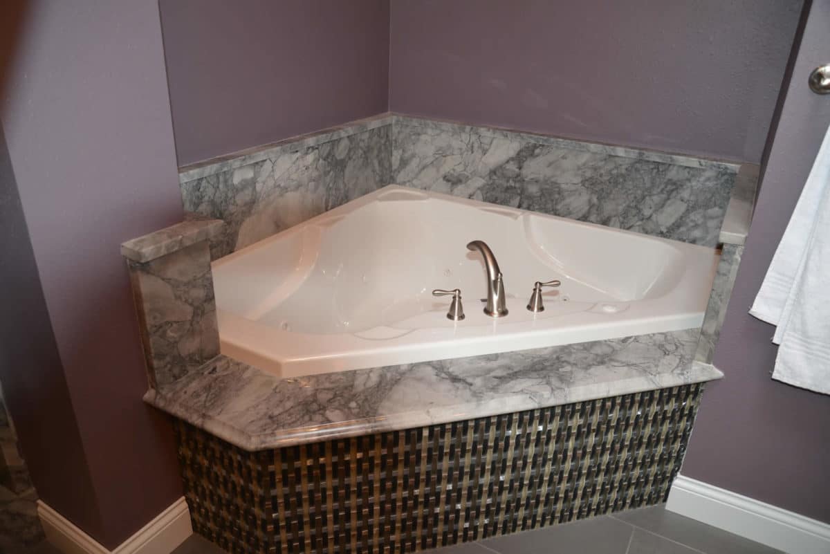 Natural stone tub deck fabricated by Granite Works