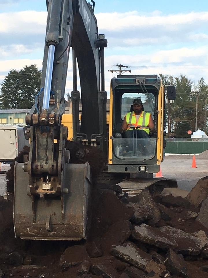 Operator at the controls of a Volvo excavator