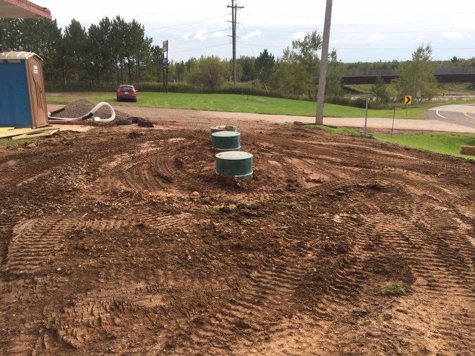 Septic tank risers installed on a graded site