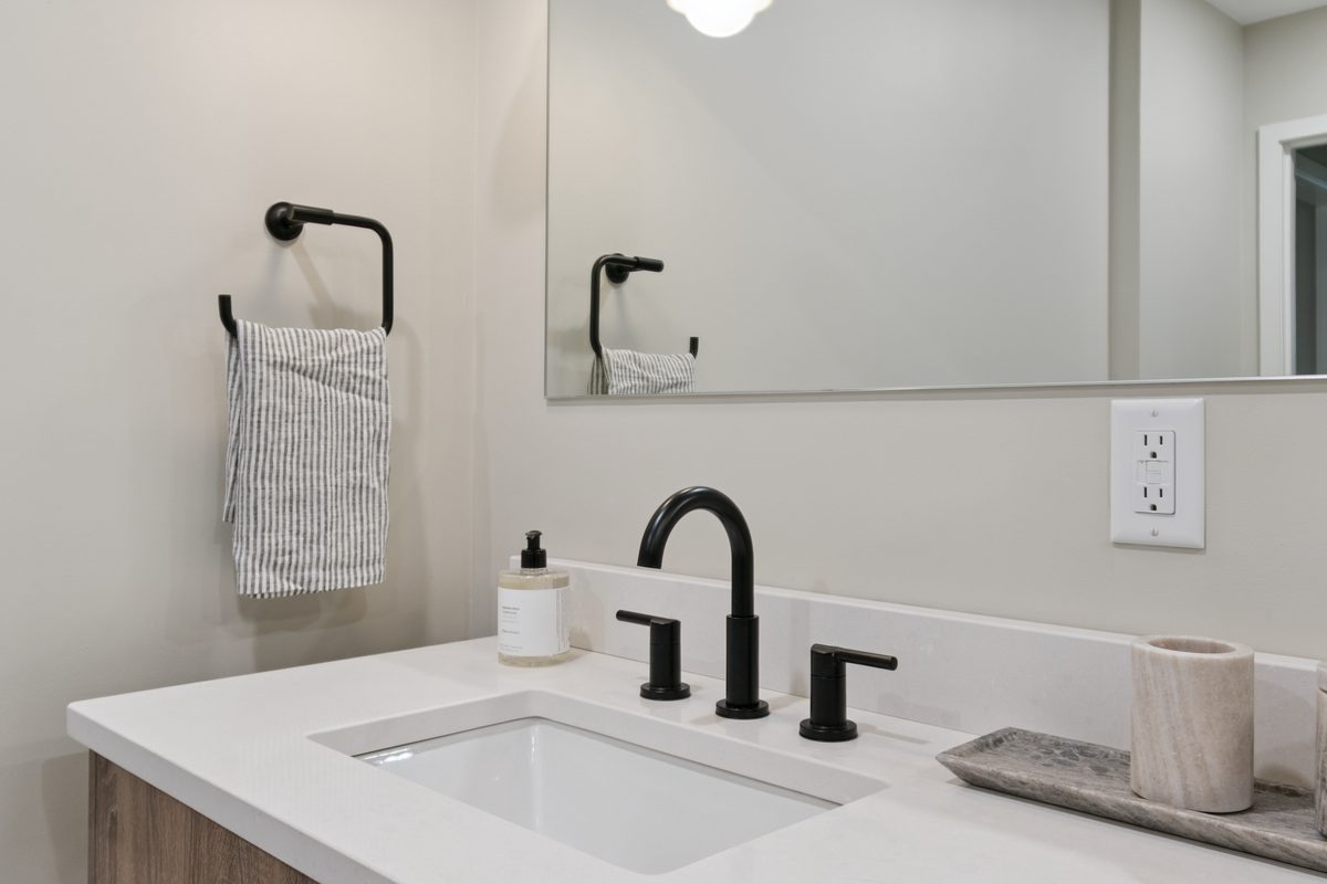 Bathroom vanity with matte black fixtures, North Ashley Street, Ann Arbor