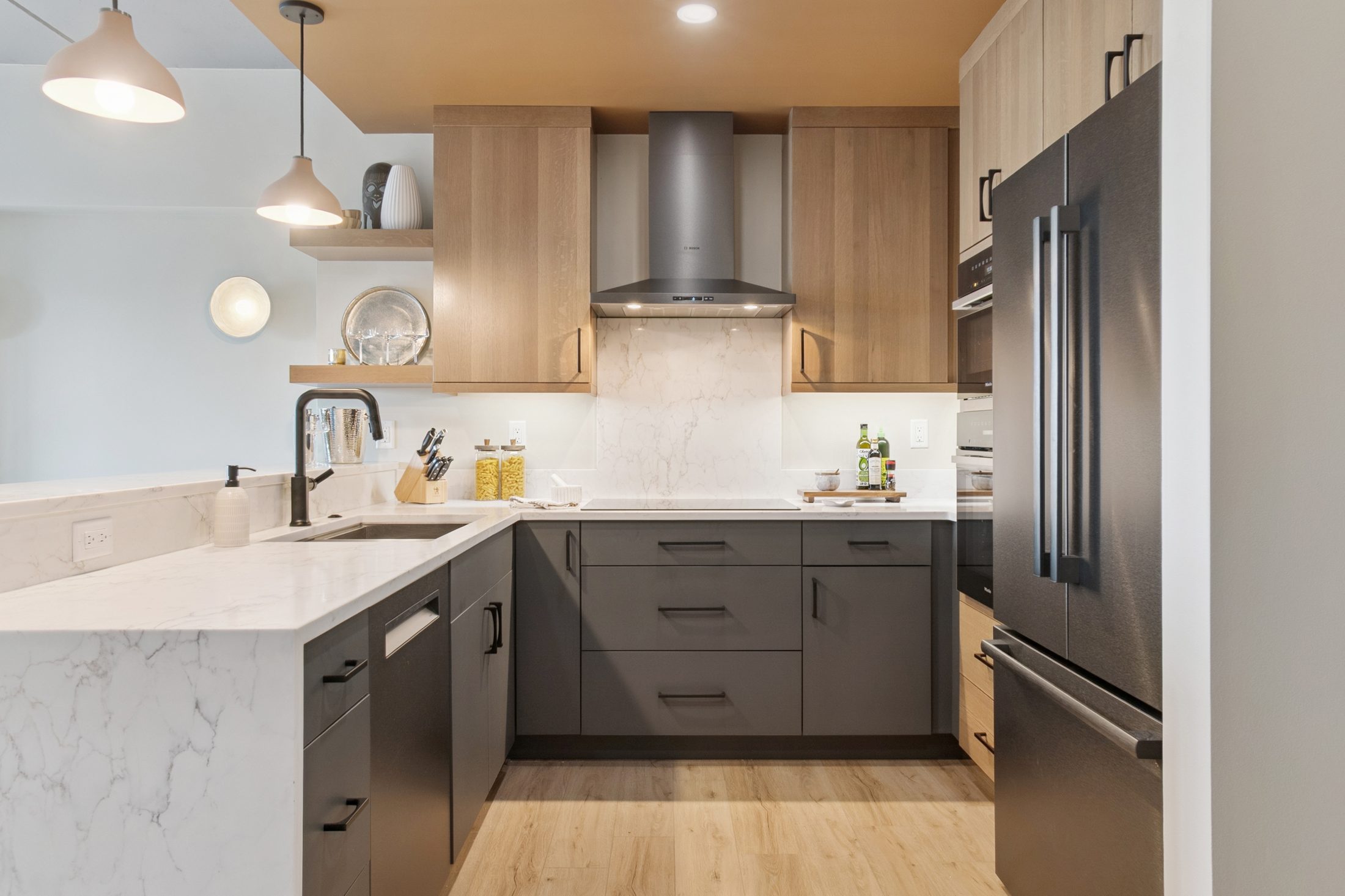 A warm modern kitchen remodel by Momentum Construction on North Ashley Street, Ann Arbor