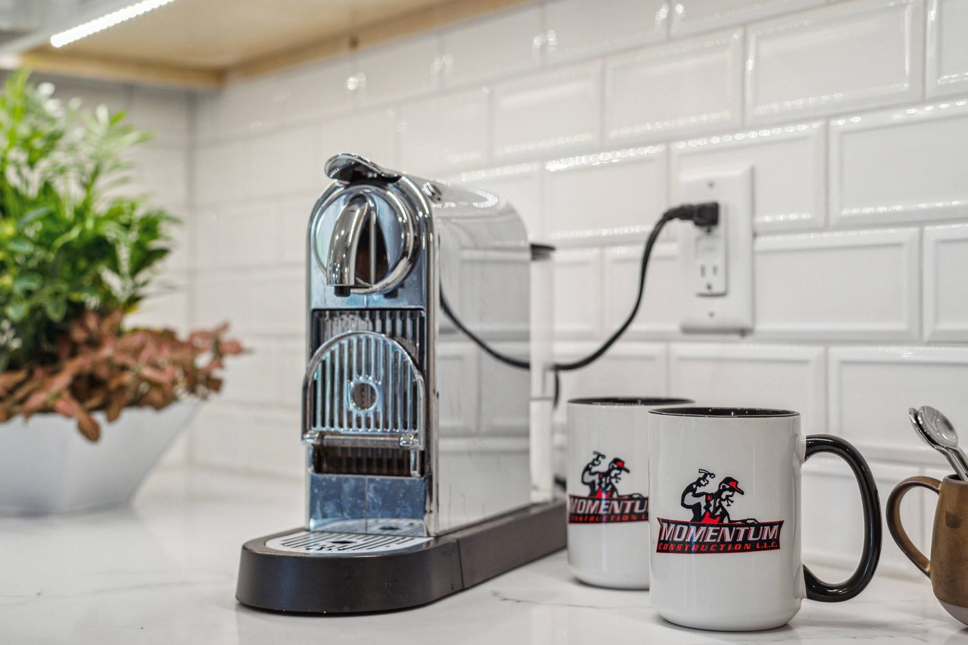 Momentum Construction mugs on a finished custom kitchen counter