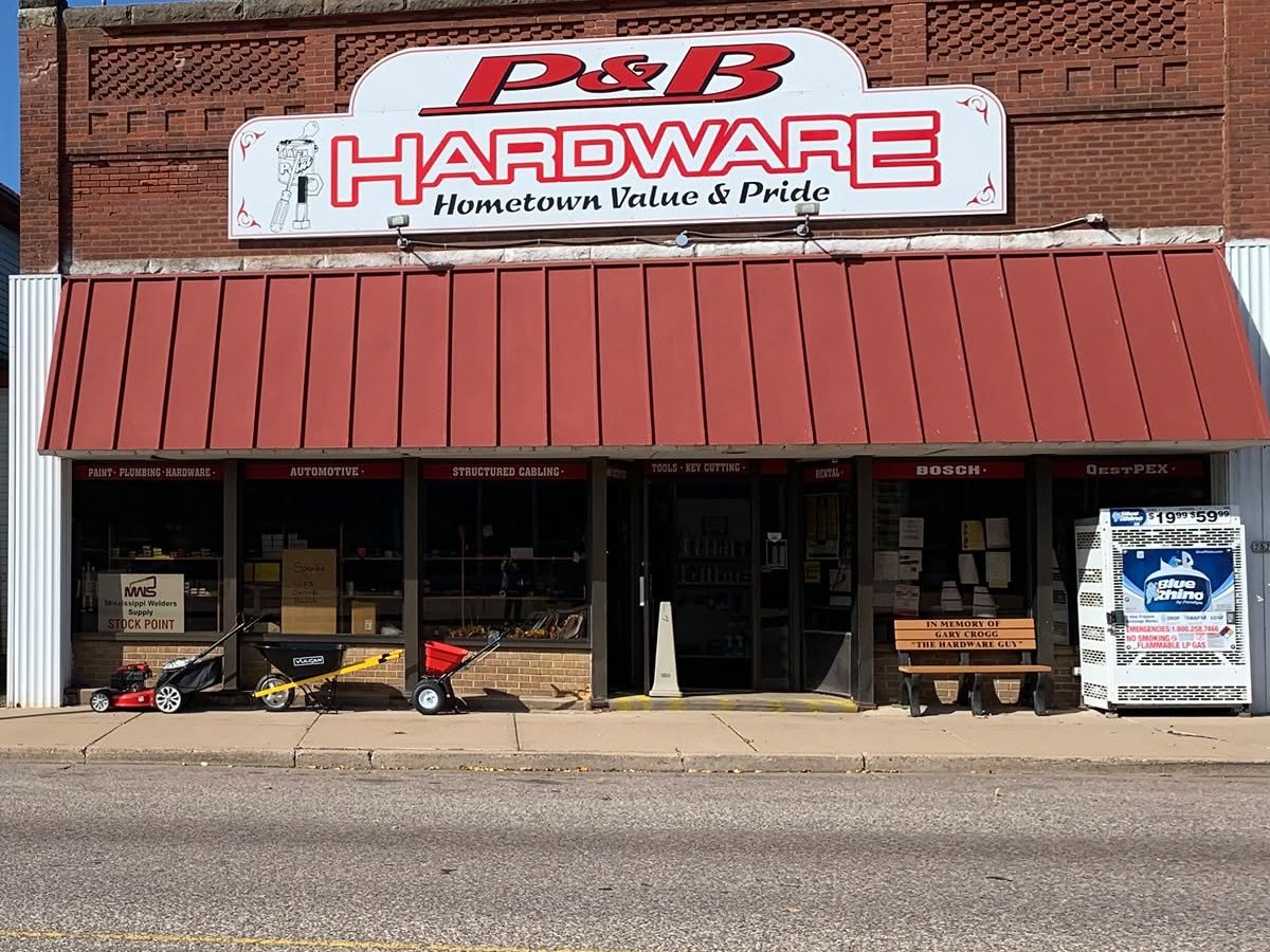 The P&B Hardware sign and red awning listing paint, plumbing, hardware, automotive, tools, key cutting and rental