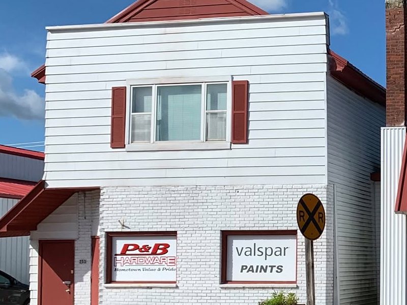 The white building with the P&B Hardware and Valspar Paints signs