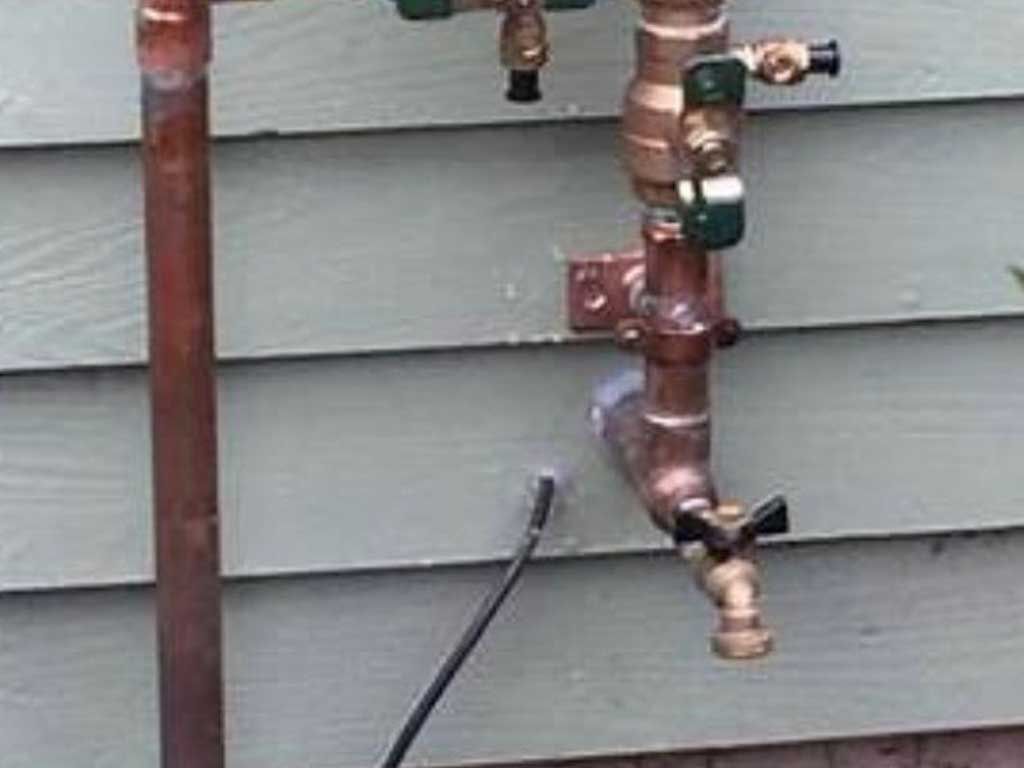 New copper backflow preventer and exterior spigot
