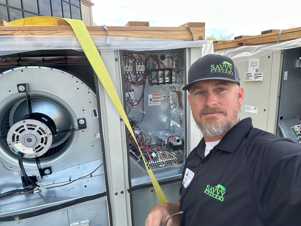 Tyler Whipple on a commercial rooftop HVAC job in Phoenix