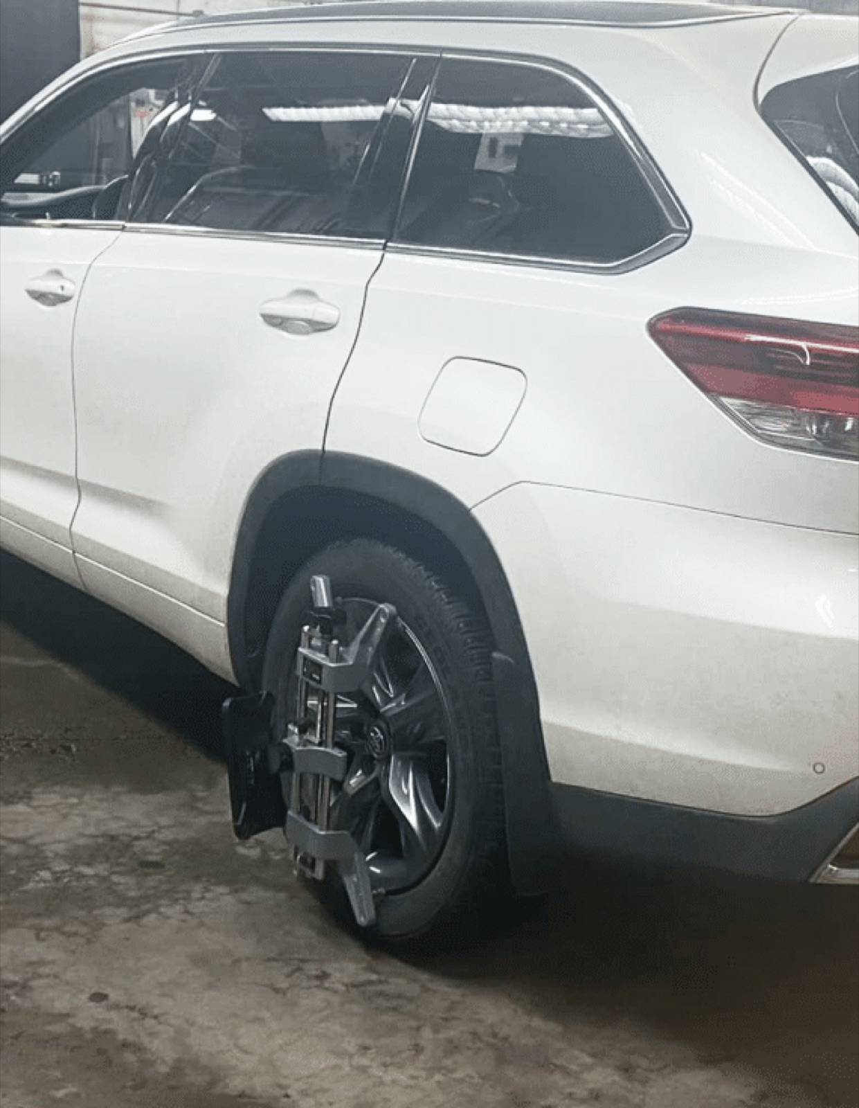 ADAS recalibration target rig mounted on an SUV wheel at SGI