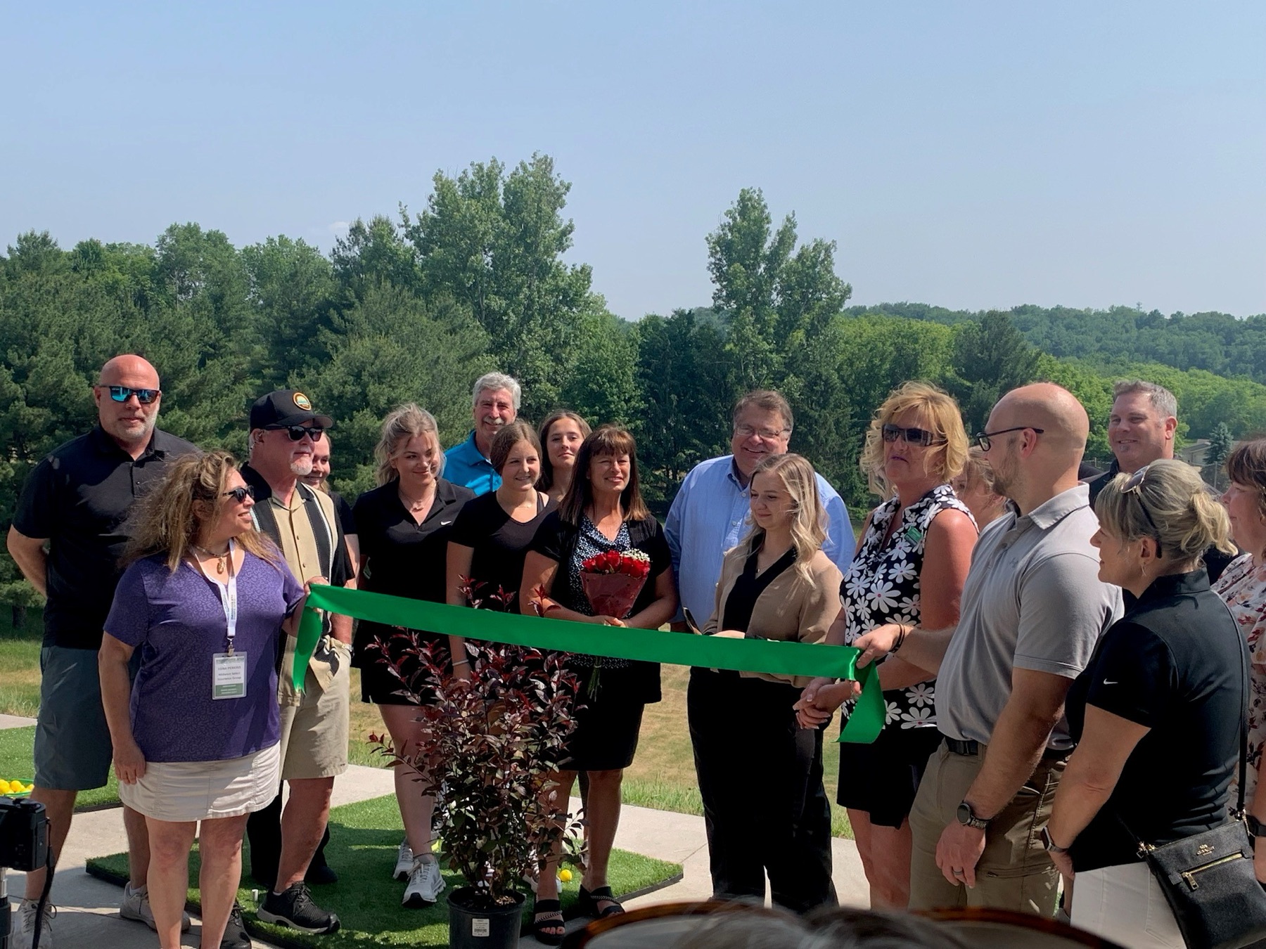 The community at the Tanglewood Greens reopening ribbon cutting