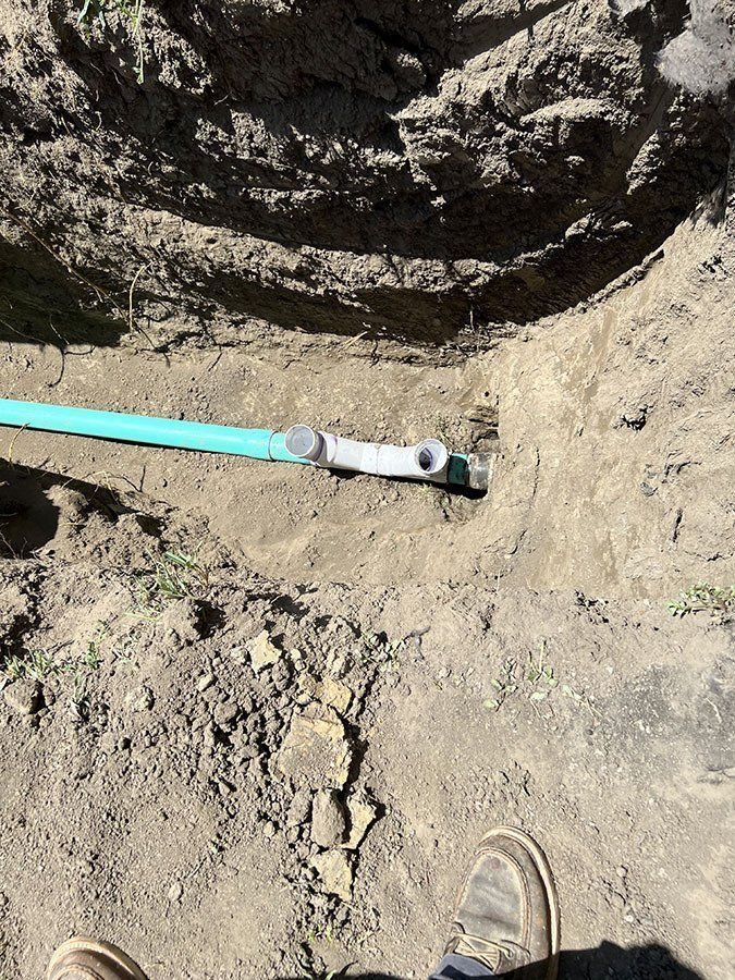 New water service line in an excavated yard